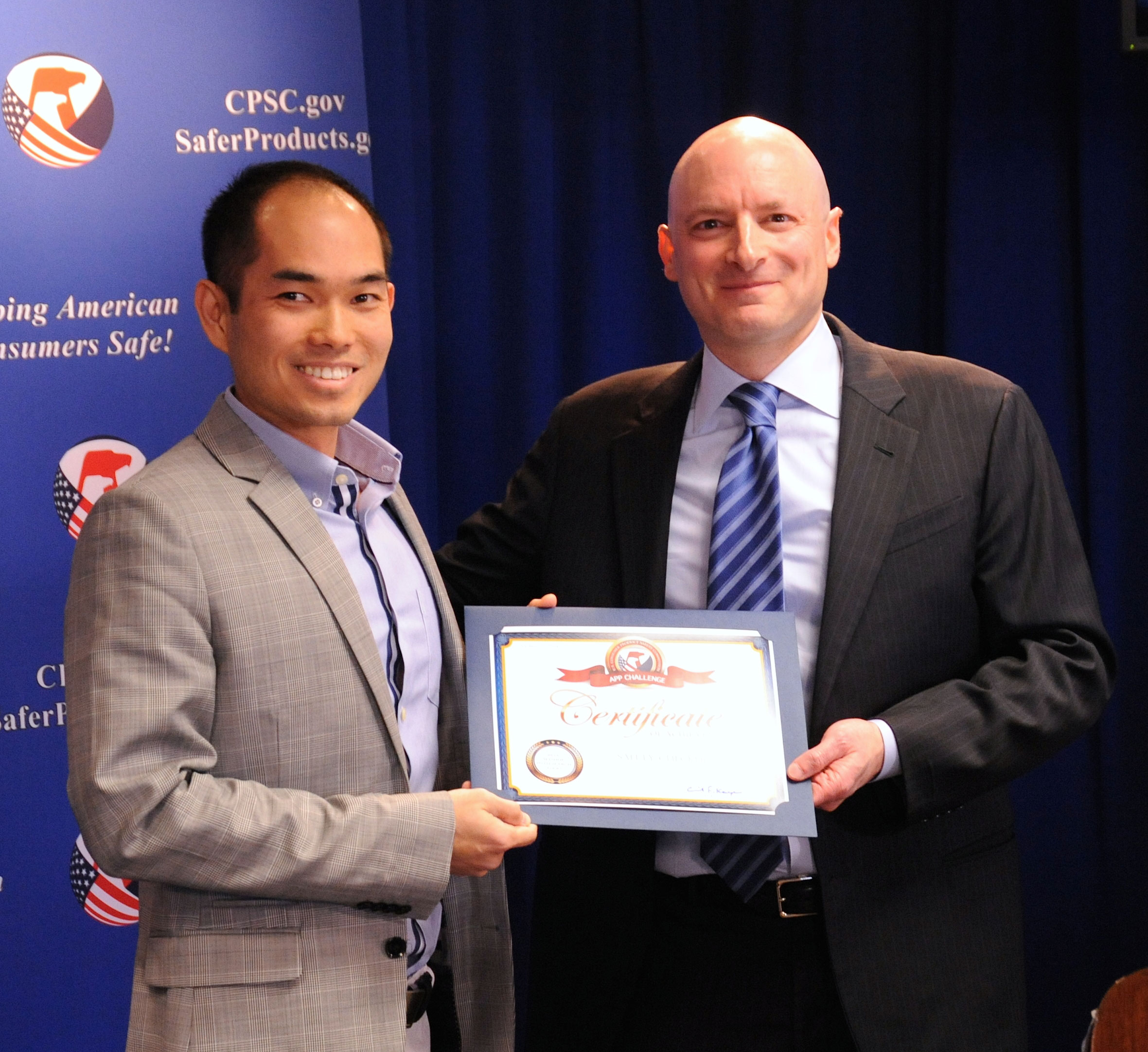 Tom Nguyen receives his certificate from Chairman Kaye. Tom won “Most Innovative” category for his Safety Checker app.