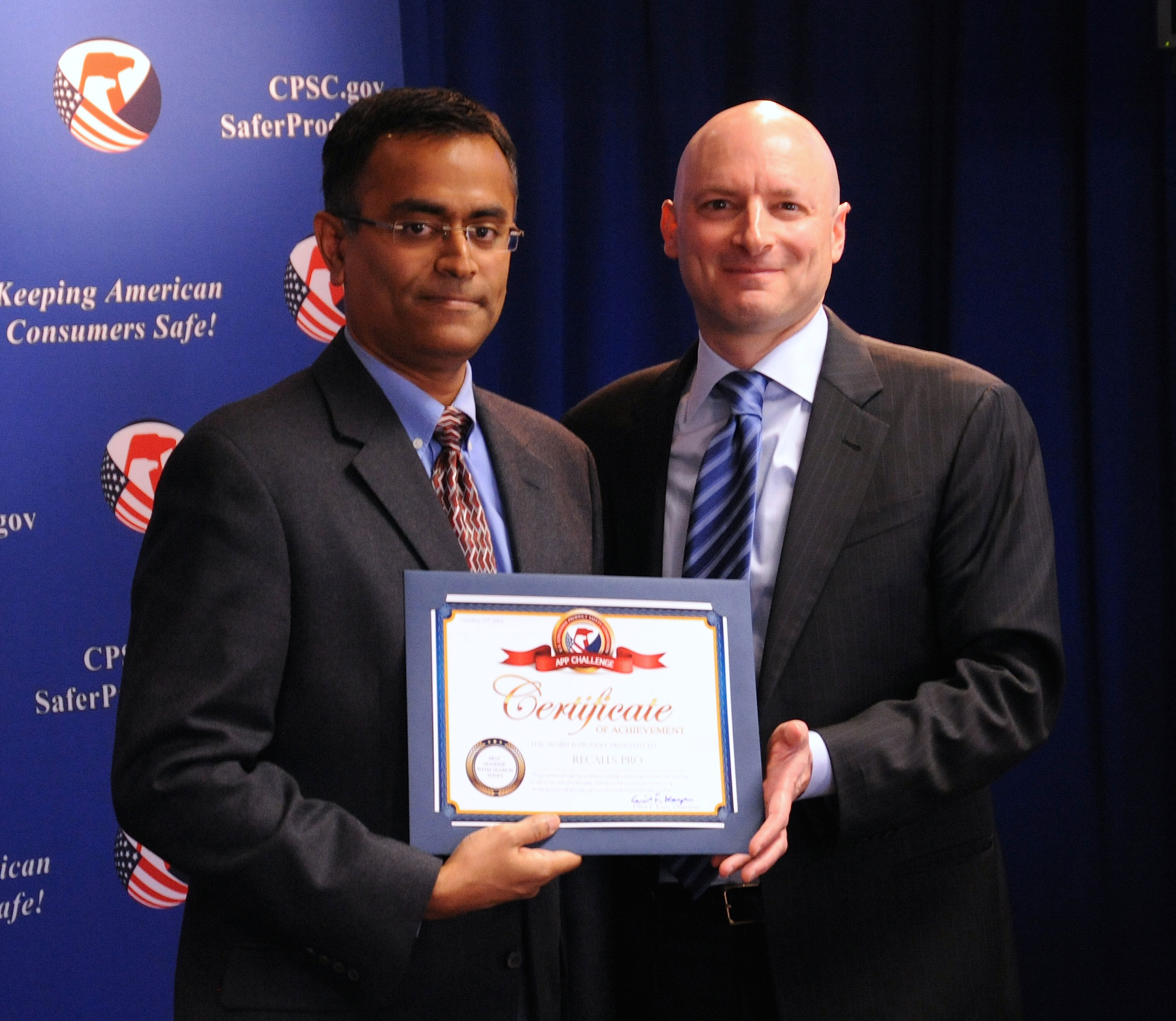 Zech Kottilil receives his certificate from Chairman Kaye. Zech won “Best Mashup with Search Tools” category for his Recall Pro app.
