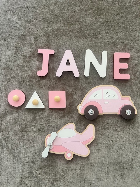 Busy Board toy-pieces included in the product (note that JANE is an example name)