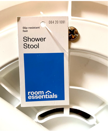 The Room Essentials logo and item number 064-20-1091 are printed on the front of the recalled shower stoola??s hangtag.