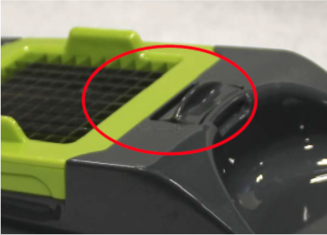 Recalled choppers have locking tabs that can be pushed towards the blades in order to lock into place.