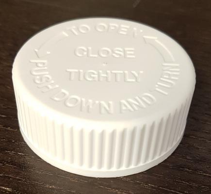 Bottle cap with indented lettering