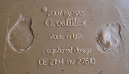 Grosfillex and CE # 2194 is molded on the underside of the seat.