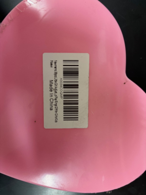 “Newmemo” and “Amazon FNSKU X0034COQMP” appear on a label on the underside of the ring’s packaging.