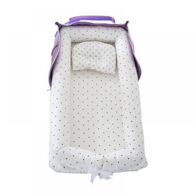 Style Life Eleven Portable Bassinets in the pattern of Purple/White Polka Dots