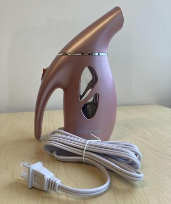 Uomeod Mini Steamer in rose gold with attached power cord