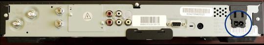 Back of the recalled Motorola DCT2000 cable set-top box with the power cord pins circled