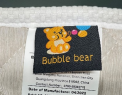 Sewn-in Bubble Bear Label on Side of Mattress